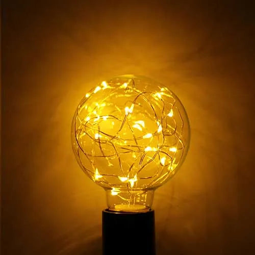 Lampe LED E27 filament G95 fil de cuivre 1,5W 2100K ambre